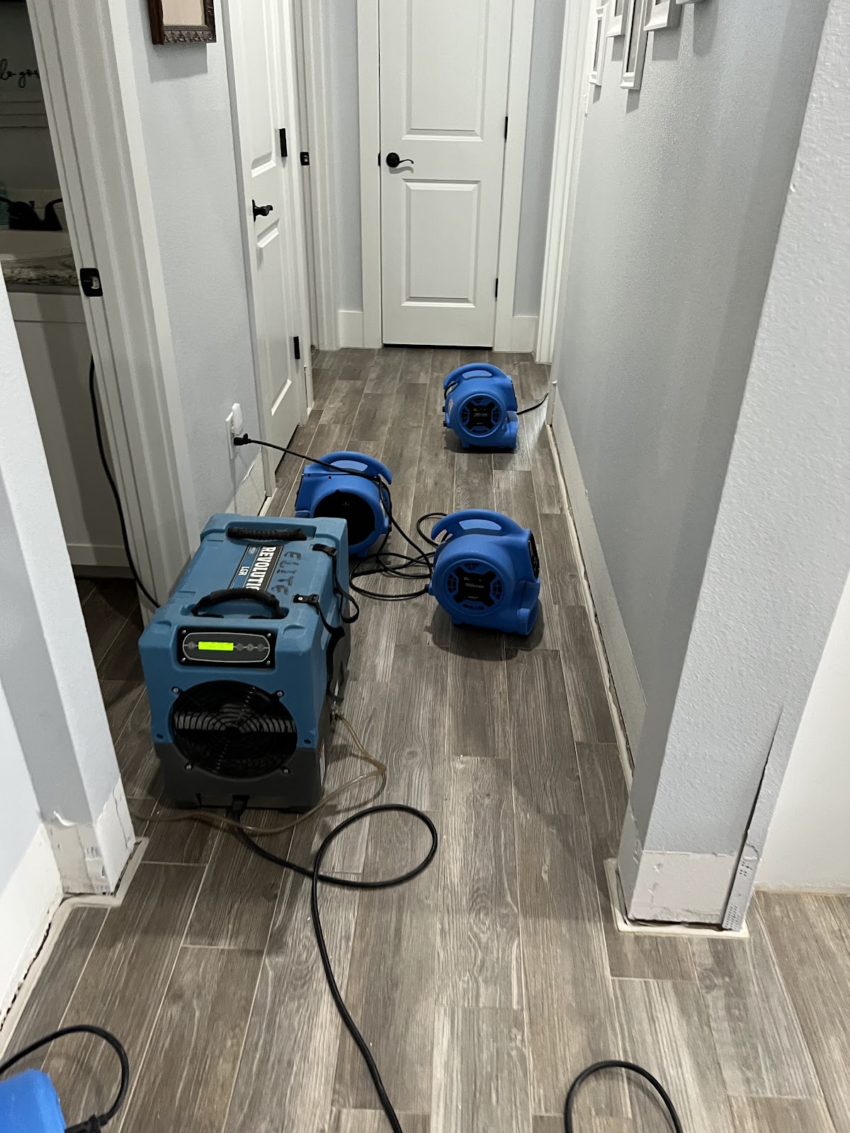 Water restoration drying equipment set up in a Lubbock home